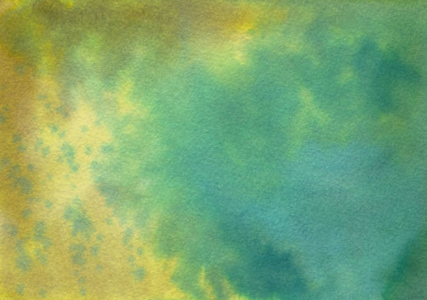 istock Mottled hand painted green and yellow watercolor background 913496840