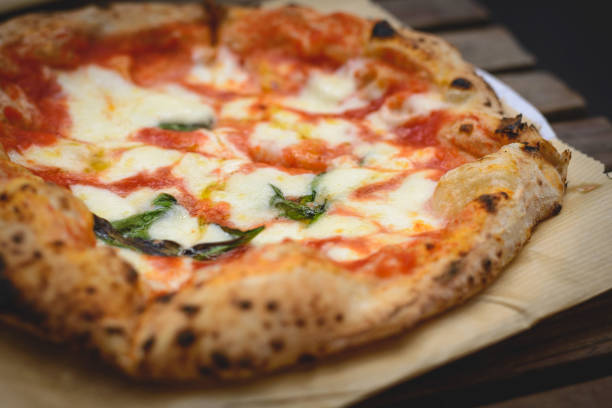 close up view of a margherita neapolitan style pizza with buffalo mozzarella, tomato sauce and basil. - mozzarella cheese italy tomato imagens e fotografias de stock