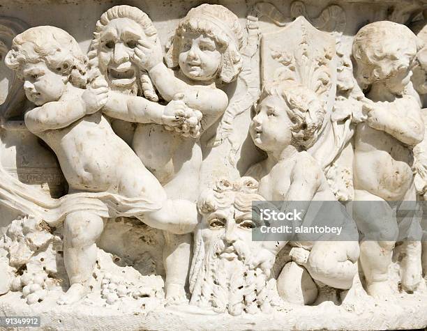 Marble Frieze Of Children With Theatrical Comedy And Tragedy Masks Stock Photo - Download Image Now