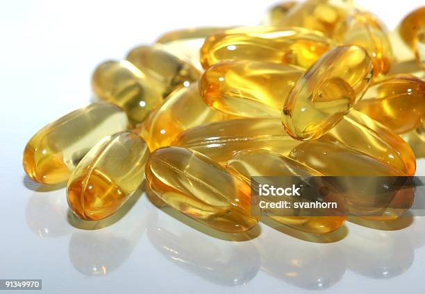 Fish Oil Supplements Stock Photo - Download Image Now - Capsule - Medicine, Color Image, Cooking Oil