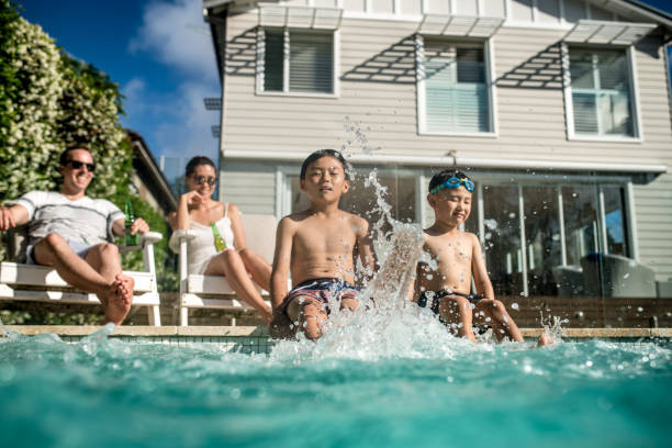 istock Boys kicking in the water 913504388