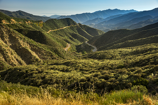 Roads run through the green mountain region of Ojai California United States