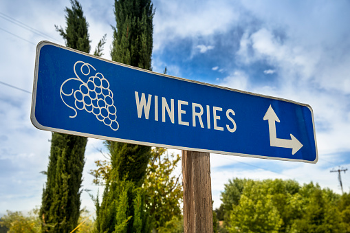 Vineyard signpost and directions to grape crops