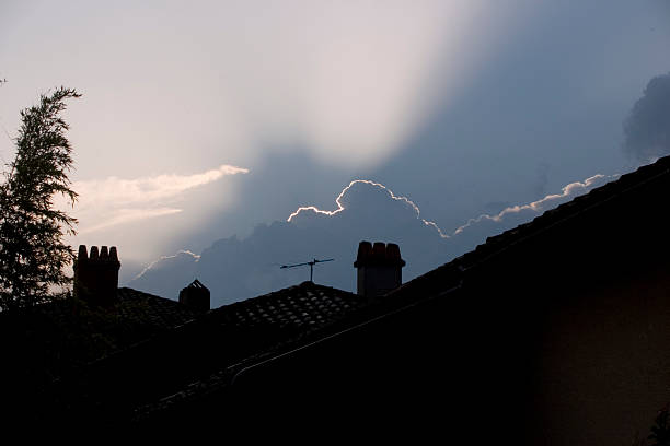 silhouet of cloud and house stock photo