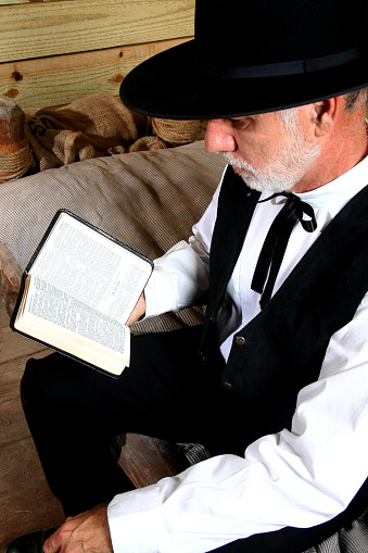 A man reading from the Book of Isaiah. 