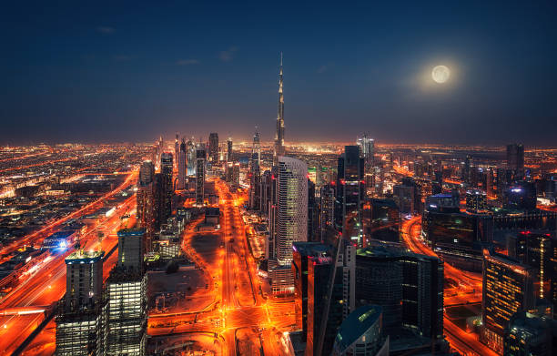 istock Dubai at night with full moon United Arab Eimirates 913519382