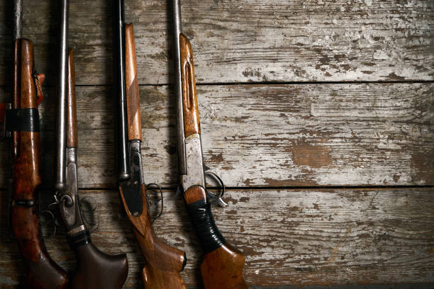 istock Hunting guns frame on wooden table 913522486