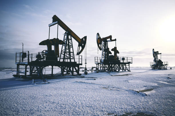 istock Oil rig, snow winter, oil pump 913524956