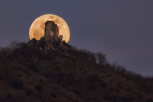 Full moon rising behind Gebara castle ruin  in Alava