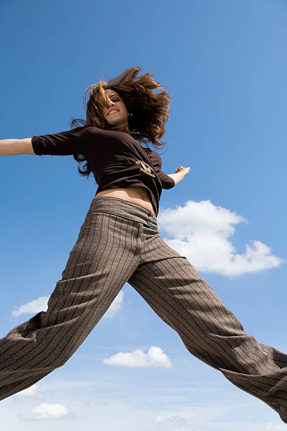 istock Beautiful girl jumping high 91352952