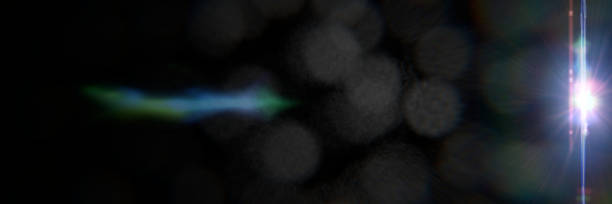 istock bright blue lens flare effect overlay texture banner with bokeh effect and light streak in front of a black background 913531488