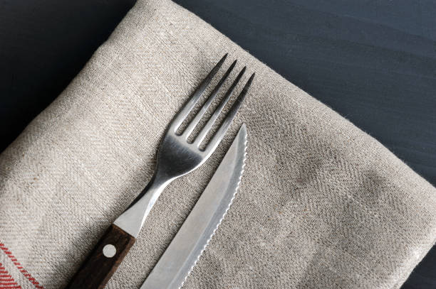 istock knife and fork on the linen tablecloth 913535066