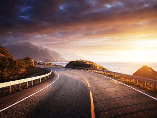 istock oad by the sea in sunrise time, Lofoten island, Norway 913535118