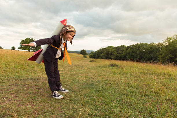 istock Young British Business Boy Wearing Rocket on Back 913539328