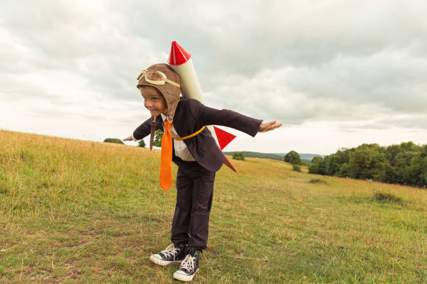 istock Young British Business Boy Wearing Rocket on Back 913539332
