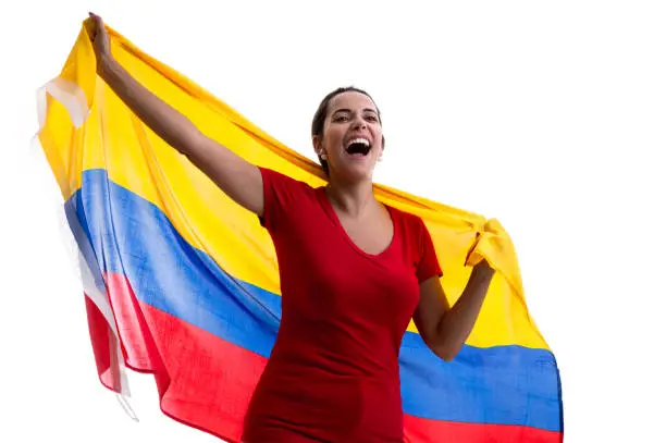 Photo of Colombian female fan celebrating on white background