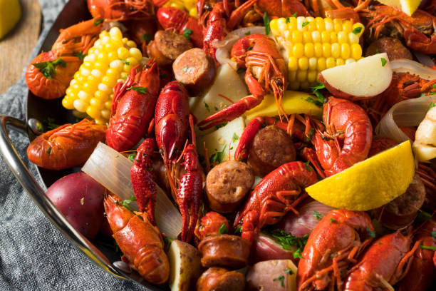 Homemade Southern Crawfish Boil Homemade Southern Crawfish Boil with Potatoes Sausage and Corn lobster seafood photos stock pictures, royalty-free photos & images