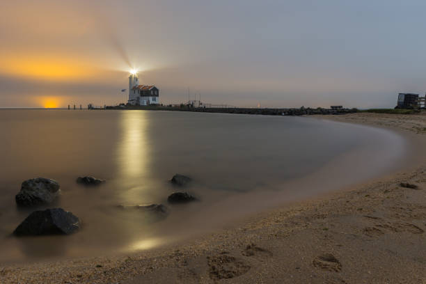 istock Beach and rocks leading to the Marken Lighthouse 913546214
