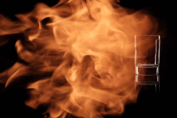 istock A small shot of vodka or tequila in the fire flames. 913557026