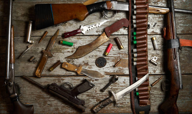 istock Hunting equipment on wooden background 913559516