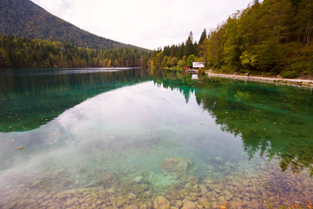 istock Autumn scenery at lake Fusine mountain lake 913559708