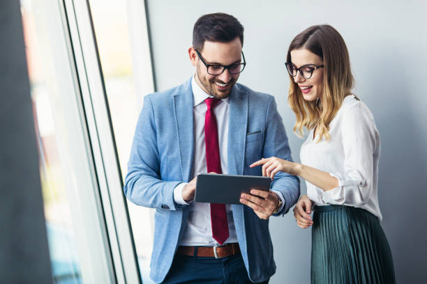 istock Colleagues discussing about business ideas on digital tablet 913560308