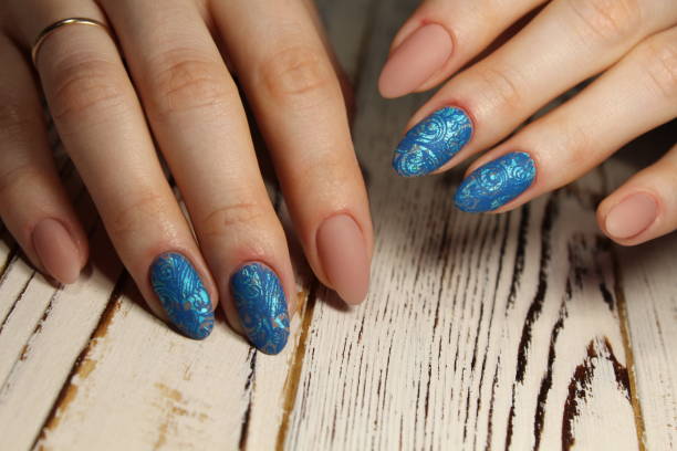 istock Manicured nails Nail Polish art design. 913563774