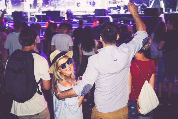 istock Hipsters dancing at the festival 913566412