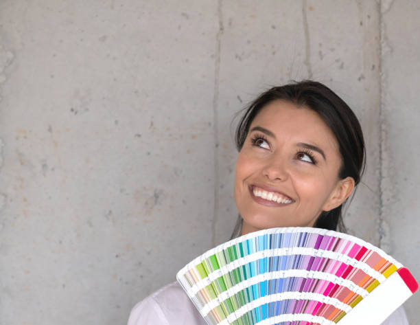 istock Thoughtful interior designer holding a color palette 913566692