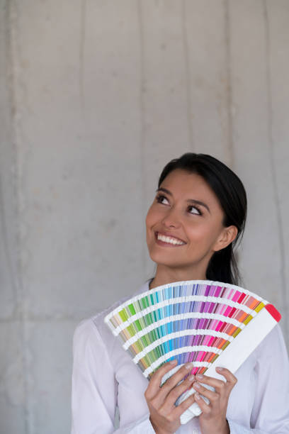 istock Thoughtful interior designer holding a color palette 913566694