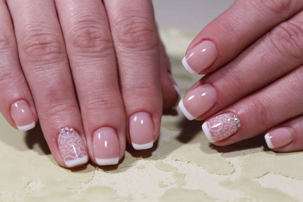 istock White French manicure design 913567910