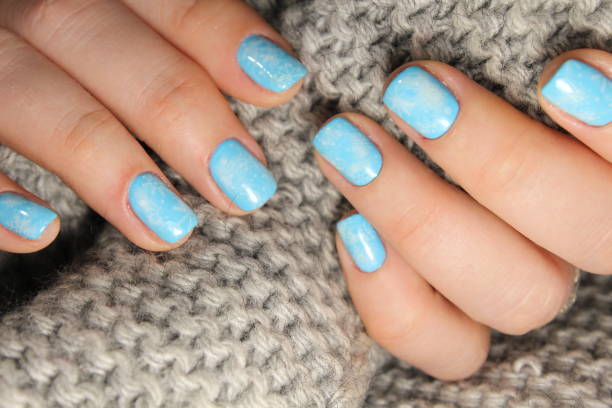 istock Christmas design manicure with snowflakes. 913570916