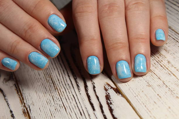 istock Christmas design manicure with snowflakes. 913570952