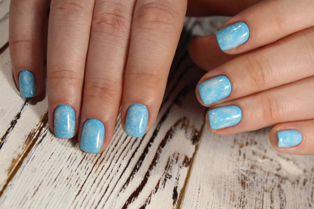 istock Christmas design manicure with snowflakes. 913571056