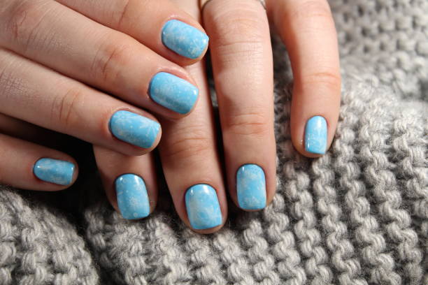 istock Christmas design manicure with snowflakes. 913571264