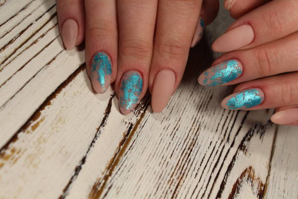 istock Manicured nails Nail Polish art design. 913573954