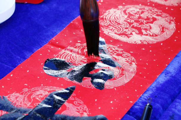 istock Chinese traditional custom: writing Spring Festival couplets. 913574190