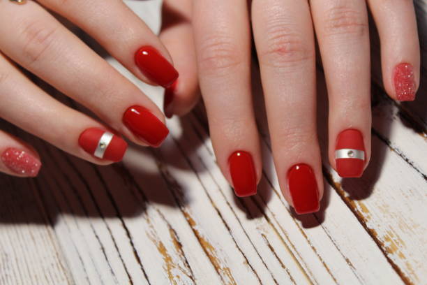 istock Manicured nails colored with red nail polish 913574204