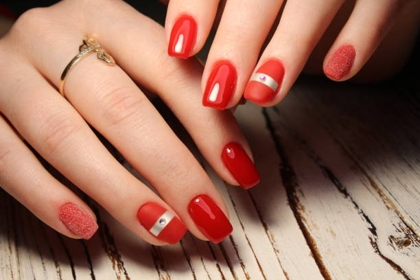 istock Manicured nails colored with red nail polish 913574714