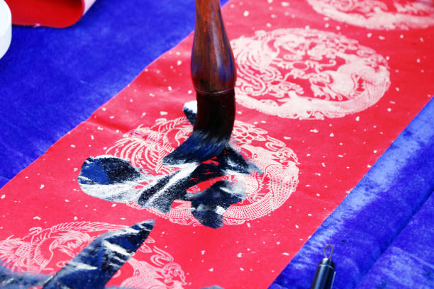 istock Chinese traditional custom: writing Spring Festival couplets. 913574762