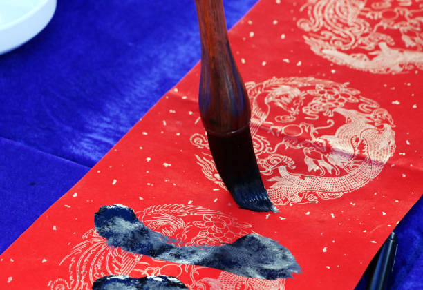 istock Chinese traditional custom: writing Spring Festival couplets. 913574796
