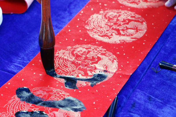 istock Chinese traditional custom: writing Spring Festival couplets. 913578024