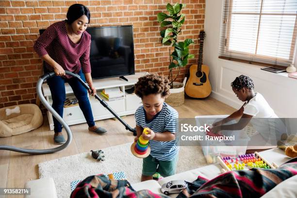 Black Family Cleaning The House Together Stock Photo - Download Image Now - Cleaning, Family, Housework