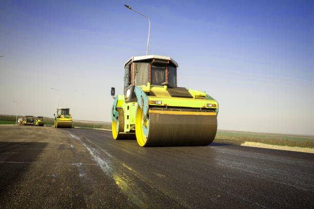 istock Large view on the road rollers working on the new road construction site 913587848