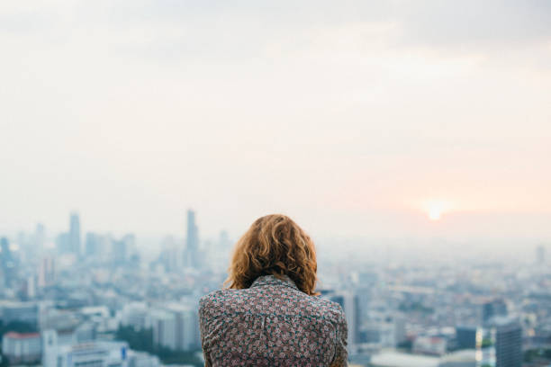 istock Blond woman at a rooftop 913588232