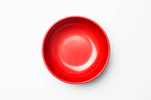 red bowl on white background - plate ceramics pottery isolated imagens e fotografias de stock