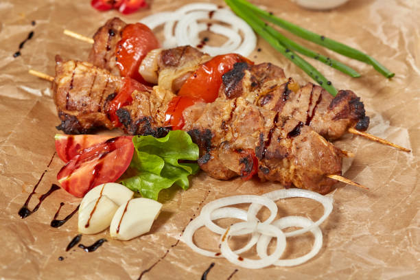 istock Pork meat kebab with sauces and vegetables 913591996