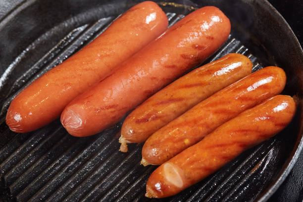 istock Grilled red hot sausages in frying pan 913592054