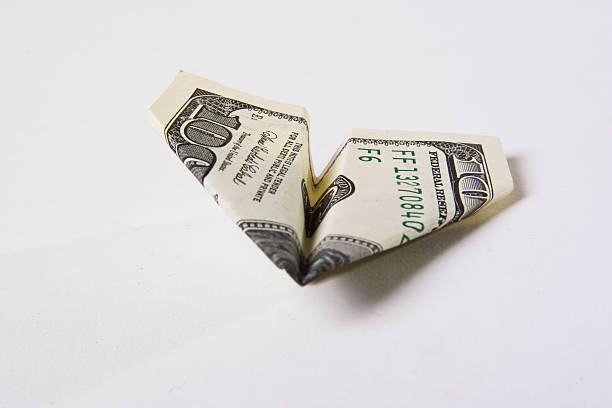 istock paper airplain made from the 100 dollars 91359286