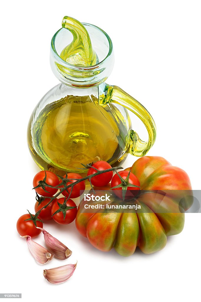 Azeite de oliva e alho com tomate. - Foto de stock de Alho royalty-free